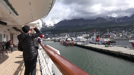 Argentina-Ushuaia-Woman-On-Ship-Looks-At-Dock