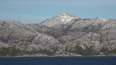 Chile-Strait-Of-Magellan-Peak-Above-Barren-Rocks