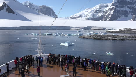 Antarctica-Neumayer-Channel-Passengers-Gather-On-Bow-Of-Ship