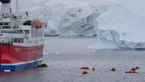 Antarctica-Zooms-To-Kayaks-Behind-An-Expedition-Ship