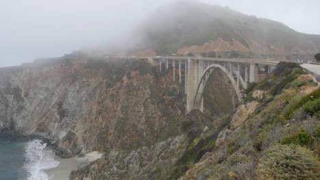 California-Big-Sur-Bixby-Bridge-With-Ocean-And-View-Into-Canyon