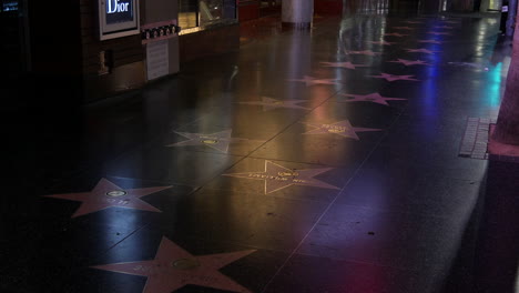 California-Hollywood-Boulevard-Name-Plaques-Lit-By-City-Lights-At-Night