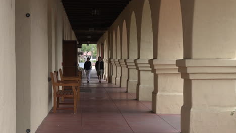 California-Solvang-Mission-Santa-Ines-Colonnade-With-Couple-Zoom-In