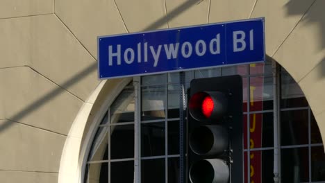 Los-Angeles-Hollywood-Street-Sign-And-Red-Traffic-Light