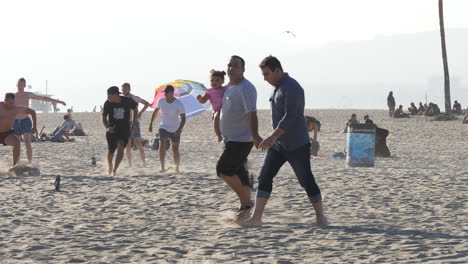 Los-Angeles-Venice-Beach-Young-Men-Playing-Soccer-Against-Bright-Hazy-Sky