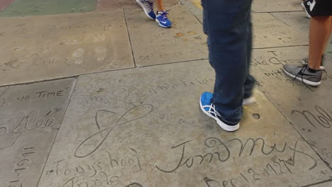 Los-Angeles-Signatures-In-The-Hollywood-Walk-Of-Fame-To-People's-Feet