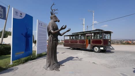 Mexico-San-Miguel-Statue-With-Deer-Head-And-Bus
