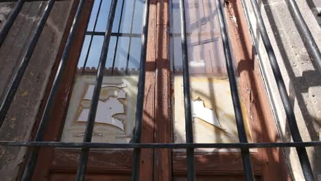 Mexico-Tlaquepaque-Broken-Window-With-Bars