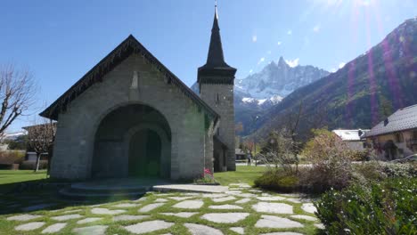 France-Chamonix-Church-With-Alps-And-Sun-Flare