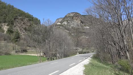 France-Houses-And-Church-Above-Road-In-The-Valley-Of-Ubaye