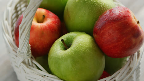 Red-and-green-apples-in-basket-