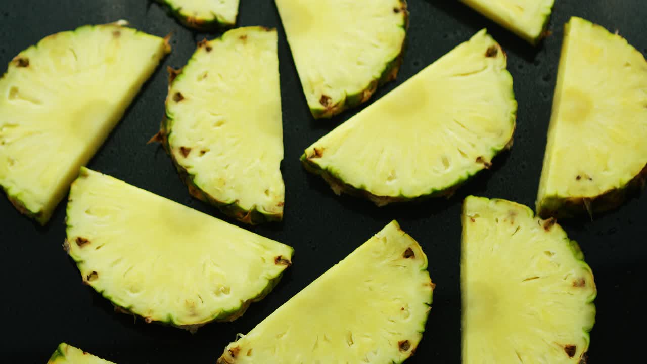 Premium stock video - Half cut pineapple pieces