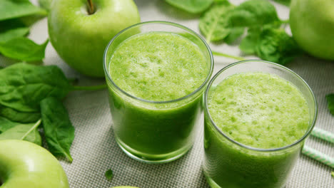 Cups-with-green-smoothie-on-table
