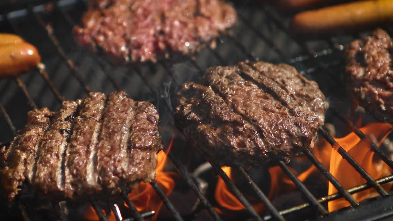 Premium stock video - Mixed american barbecue food on hot grill