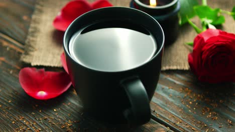 Mug-of-drink-and-red-roses