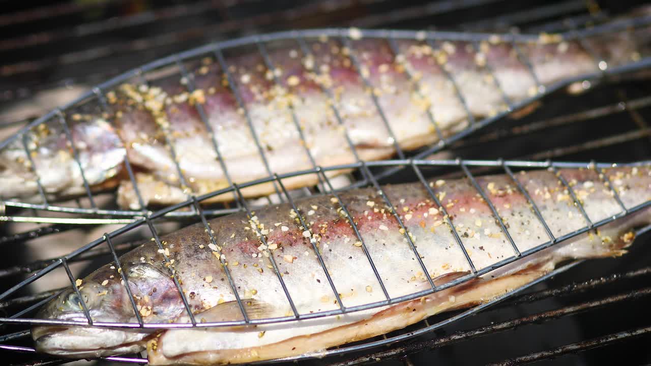 Premium stock video - Tasty whole fishes placed on barbecue grill