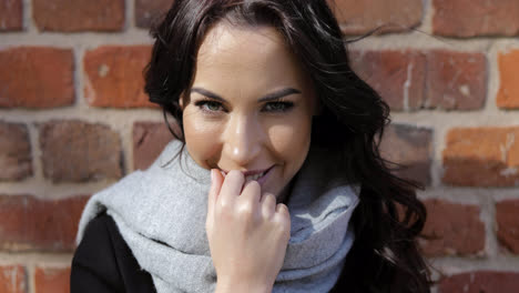 Smiling-woman-in-gray-scarf