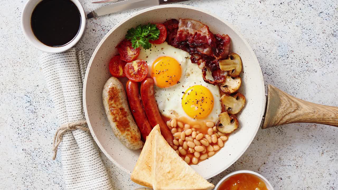 Premium stock video - Traditional full english breakfast on frying pan