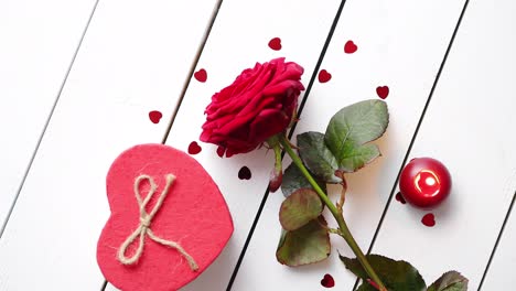 Fresh-red-rose-flower-on-the-white-wooden-table