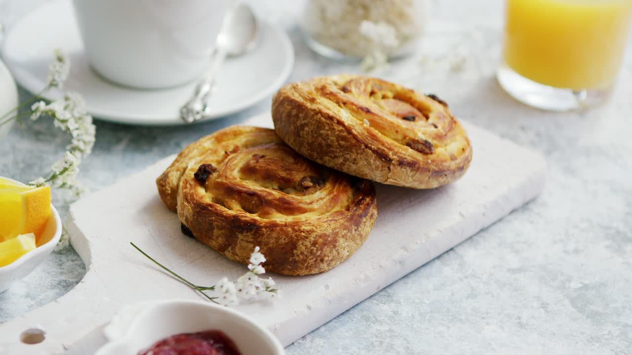 Premium stock video - Sweet buns on board for breakfast