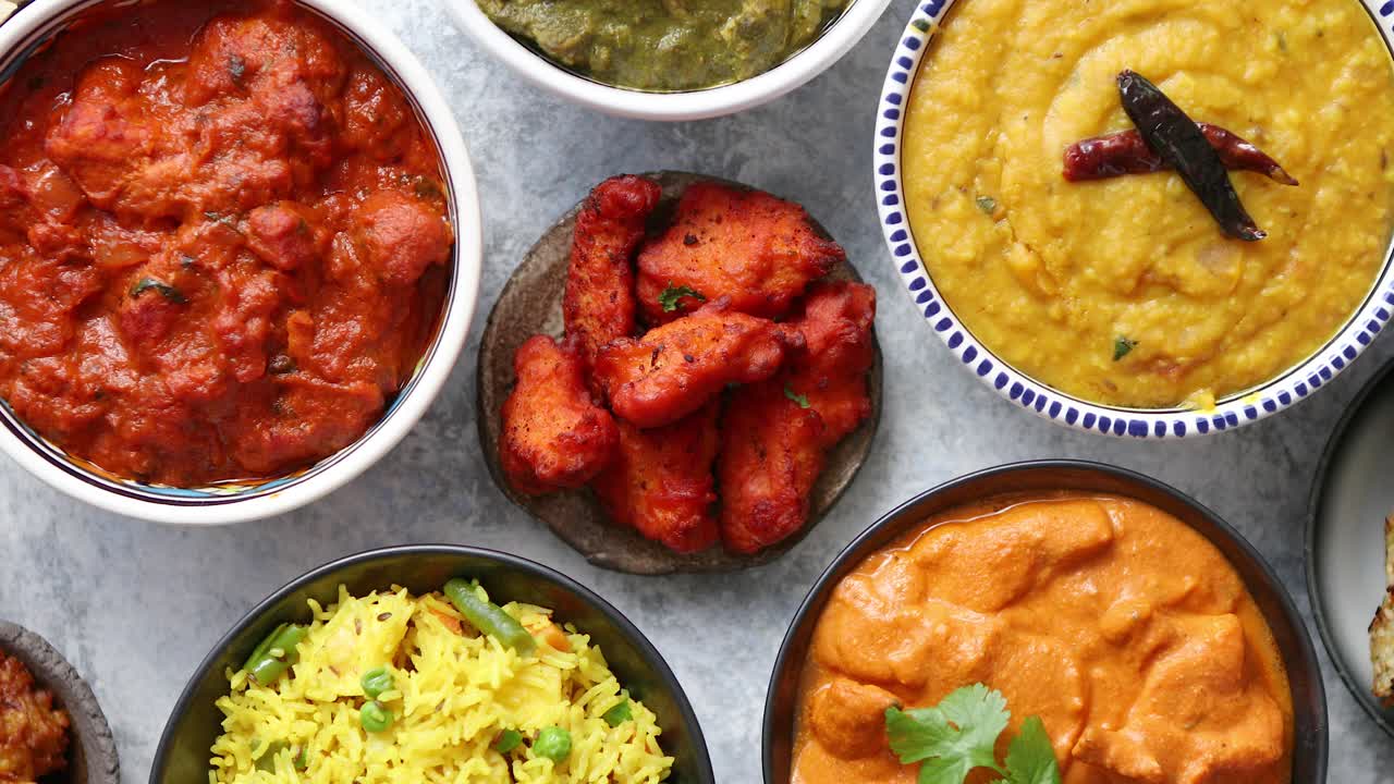 Premium stock video - Traditional indian food in ceramic bowls