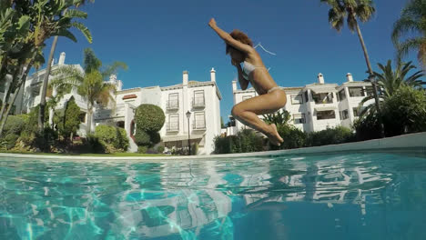 Woman-jumping-in-pool