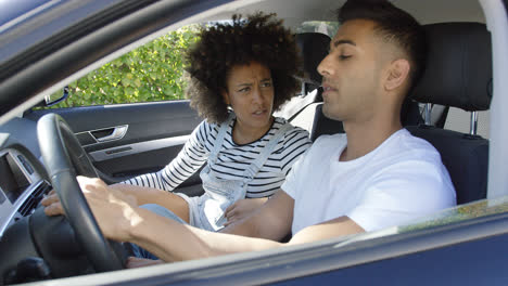 Young-couple-having-a-serious-talk-in-a-car