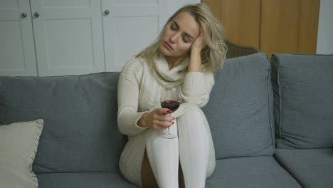 Tired-woman-with-glass-of-wine