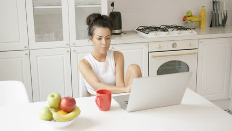 Young-female-using-laptop-at-home