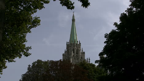 Paris-church-tower-against-dark-sky