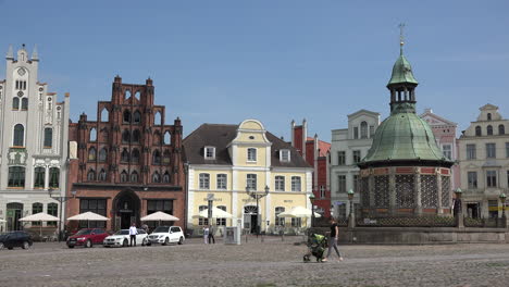 Germany-Wismar-market-square-in-sun-with-baby-buggy