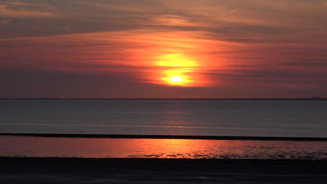 Germany-reflections-of-setting-sun-on-water-of-Wadden-Sea