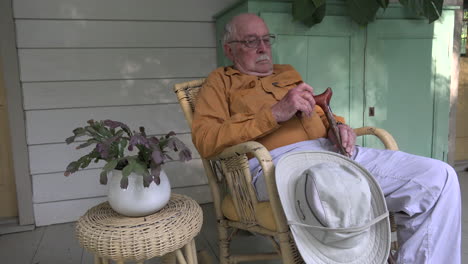 Louisiana-old-man-with-cane-in-a-chair