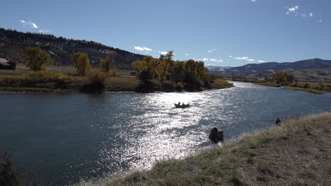 Montana-drift-boat-on-Yellowstone-passes-sunlit-water