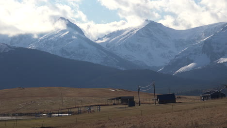 Montana-ranch-buildings-with-mountains-beyond