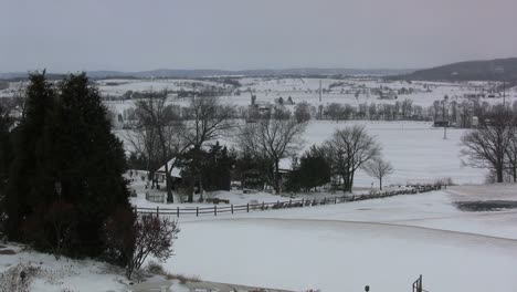 Snowy-landscape-with-farmstead