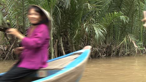 Vietnamese-paddling-canoes