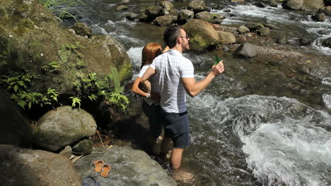 A-couple-by-a-river-in-Dominica