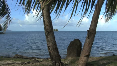 Raiatea-stone-and-palms-by-the-sea