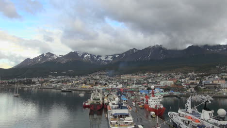 Argentina-Ushuaia-ships-on-wide-dock-and-mountains