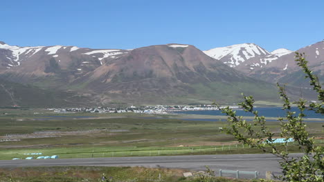 Iceland-Eyjafjordur-&-Davlik-village-below-mountains-c