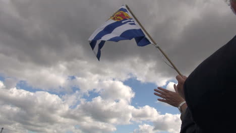 Netherlands-Rotterdam-waving-Zeeland-flag-against-clouds