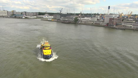 Netherlands-Rotterdam-river-yellow-fire-boat-turns