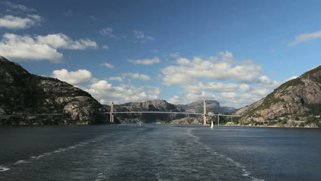 Norway-Lysefjord-wake-from-ship-with-bridge-in-distance-c