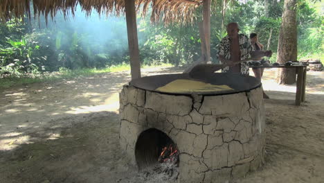 Amazon-village-man-preparing-manioc-or-cassava