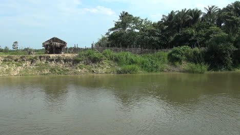 Brazil-Amazon-backwater-house-on-bank-s
