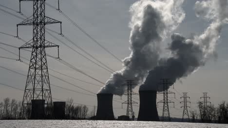 Smoke-rises-from-the-nuclear-power-plant-at-Three-Mile-Island-Pennsylvania-with-power-lines-foreground
