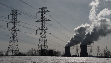 Smoke-rises-from-the-nuclear-power-plant-at-Three-Mile-Island-Pennsylvania-with-power-lines-foreground-1