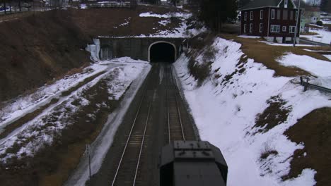 High-angle-over-a-freight-train-going-through-a-tunnel