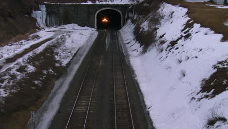 High-angle-over-a-passenger-train-going-through-a-tunnel-in-the-winter